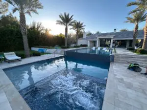 A pool with a large waterfall in the middle of it.