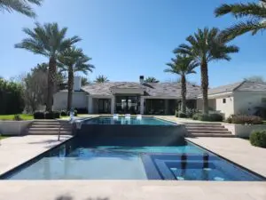 A pool with a large swimming area in the middle of it.